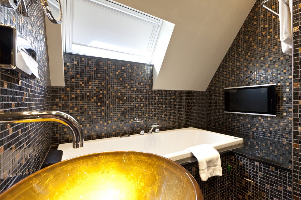 The bathroom has a jacuzzi and a shower cabin with music