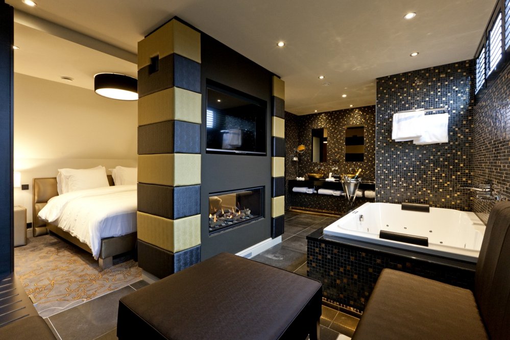 Bedroom with very spacious and open bathroom